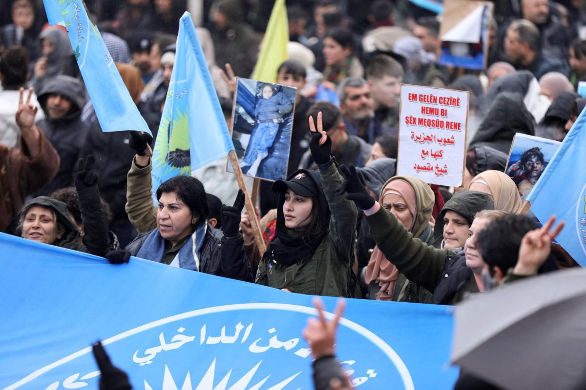 Syrian Kurds attend a protest in solidarity with the people in the neighborhood of Sheikh Maksoud and Ashrafiya, as The last Kurdish-led Syrian Democratic Forces (SDF) fighters left the Syrian city of Aleppo on Sunday, state-run Ekhbariya TV said, following a ceasefire deal that allowed evacuations after days of deadly clashes, in Qamishli, Syria January 13, 2026. REUTERS/Orhan Qereman